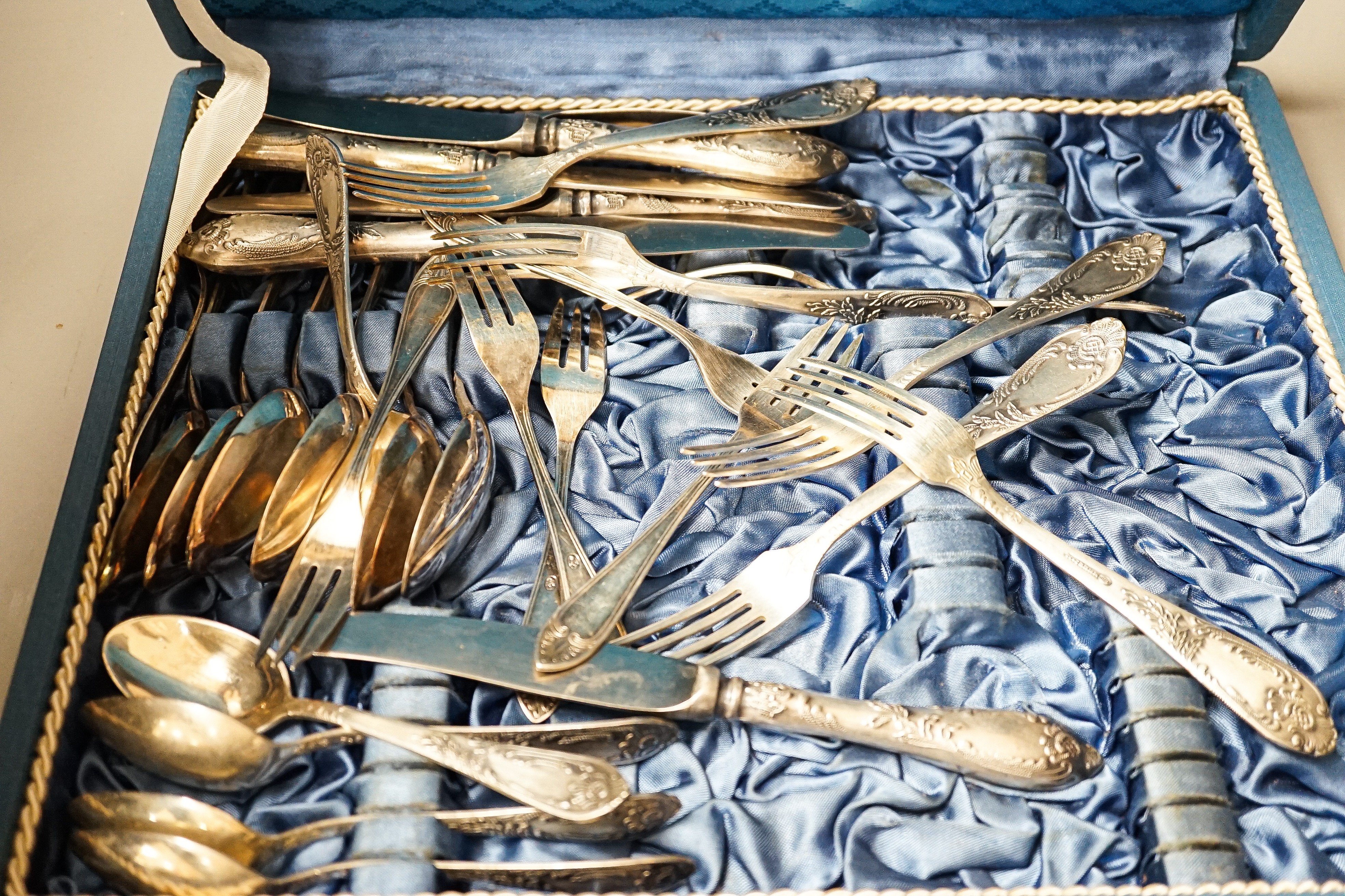 A quantity of cased silver plated cutlery sets